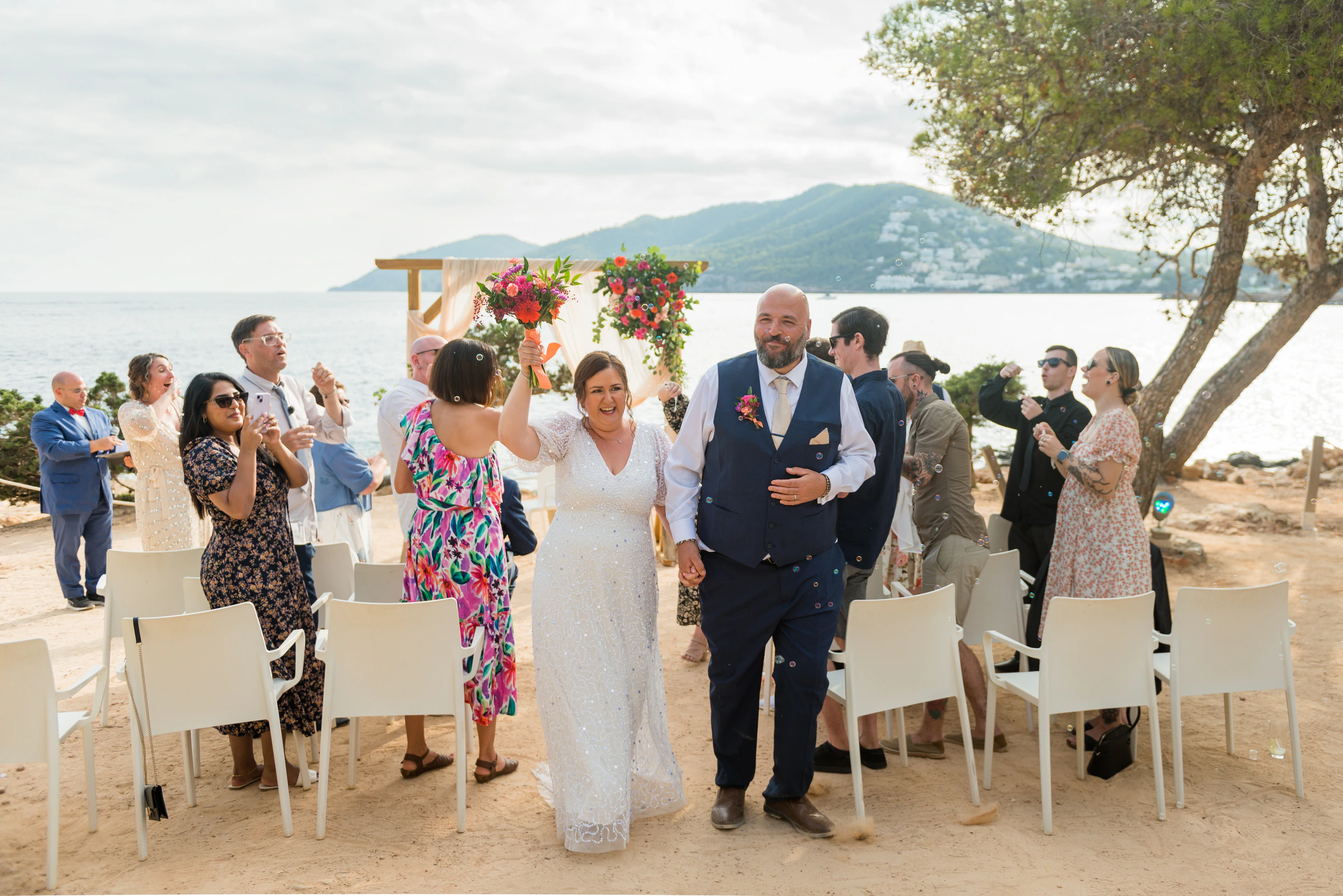 Ana and Ryan at their flower-filled seaside ceremony in Ibiza