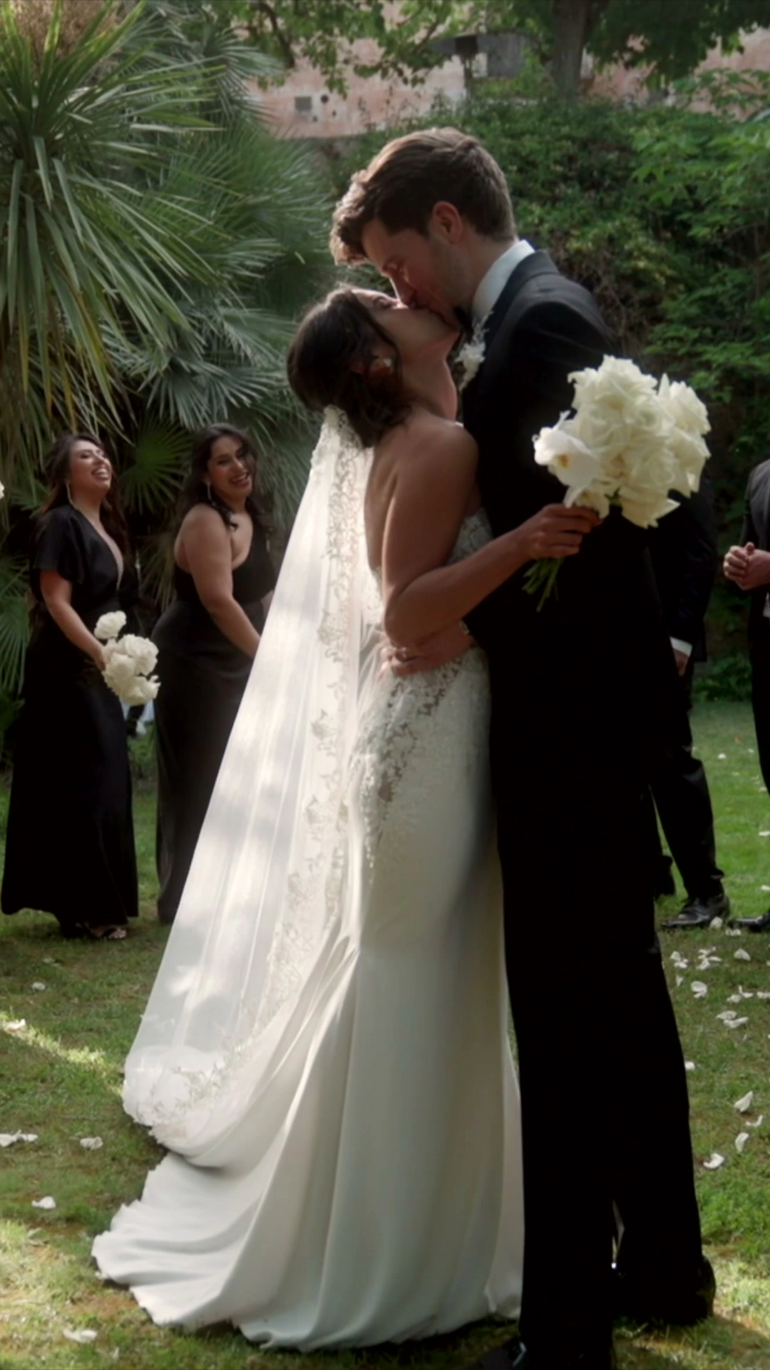 Auston and Lyanne together after their garden wedding ceremony in Sitges