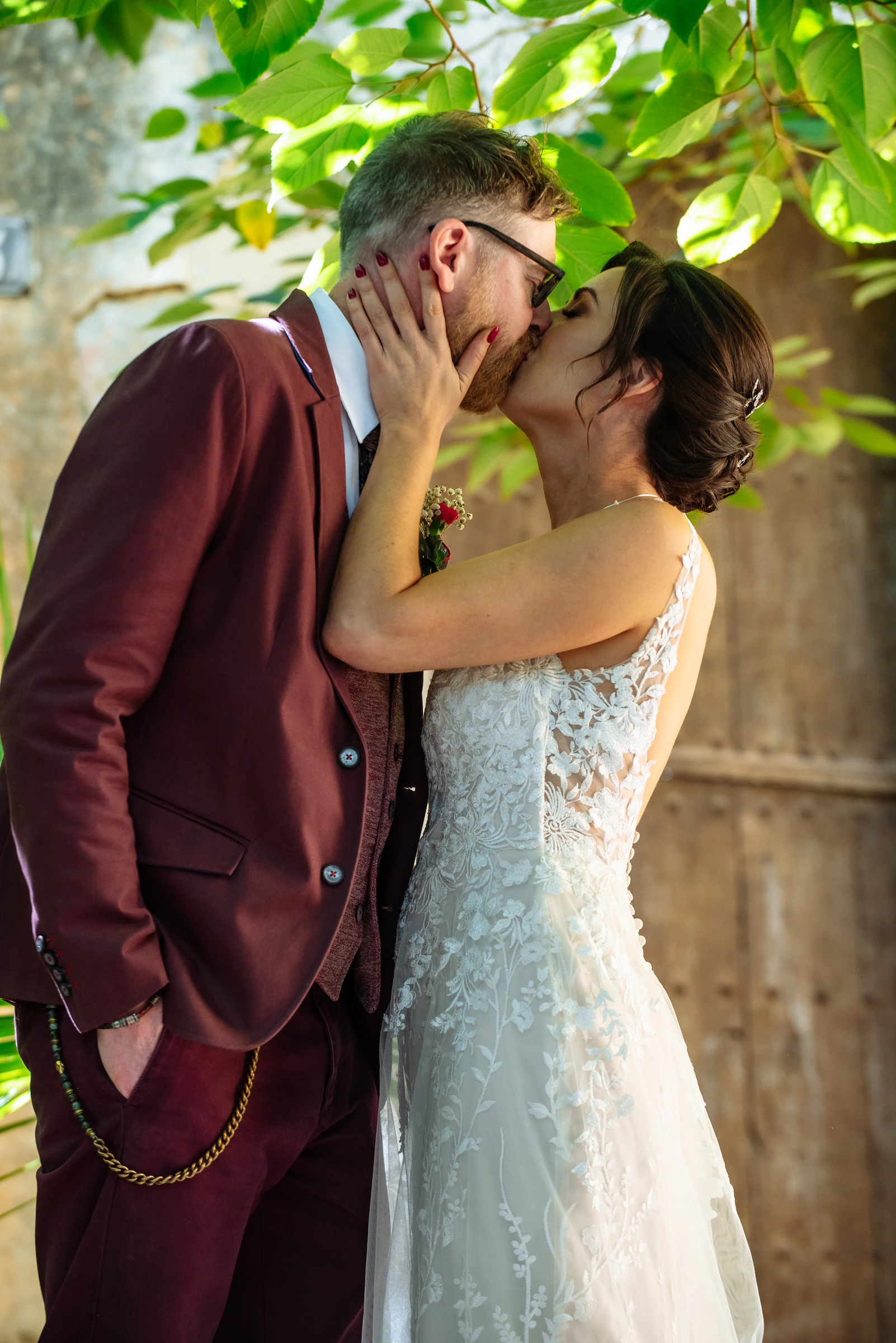 Brian and Dee kissing during their wedding celebration in Sitges