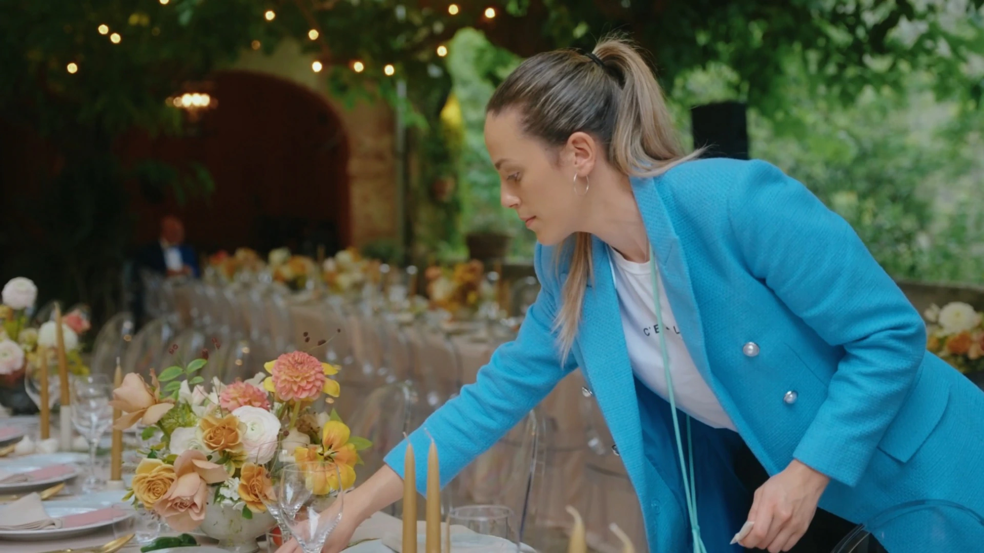 Abril Santos preparing an outdoor wedding reception