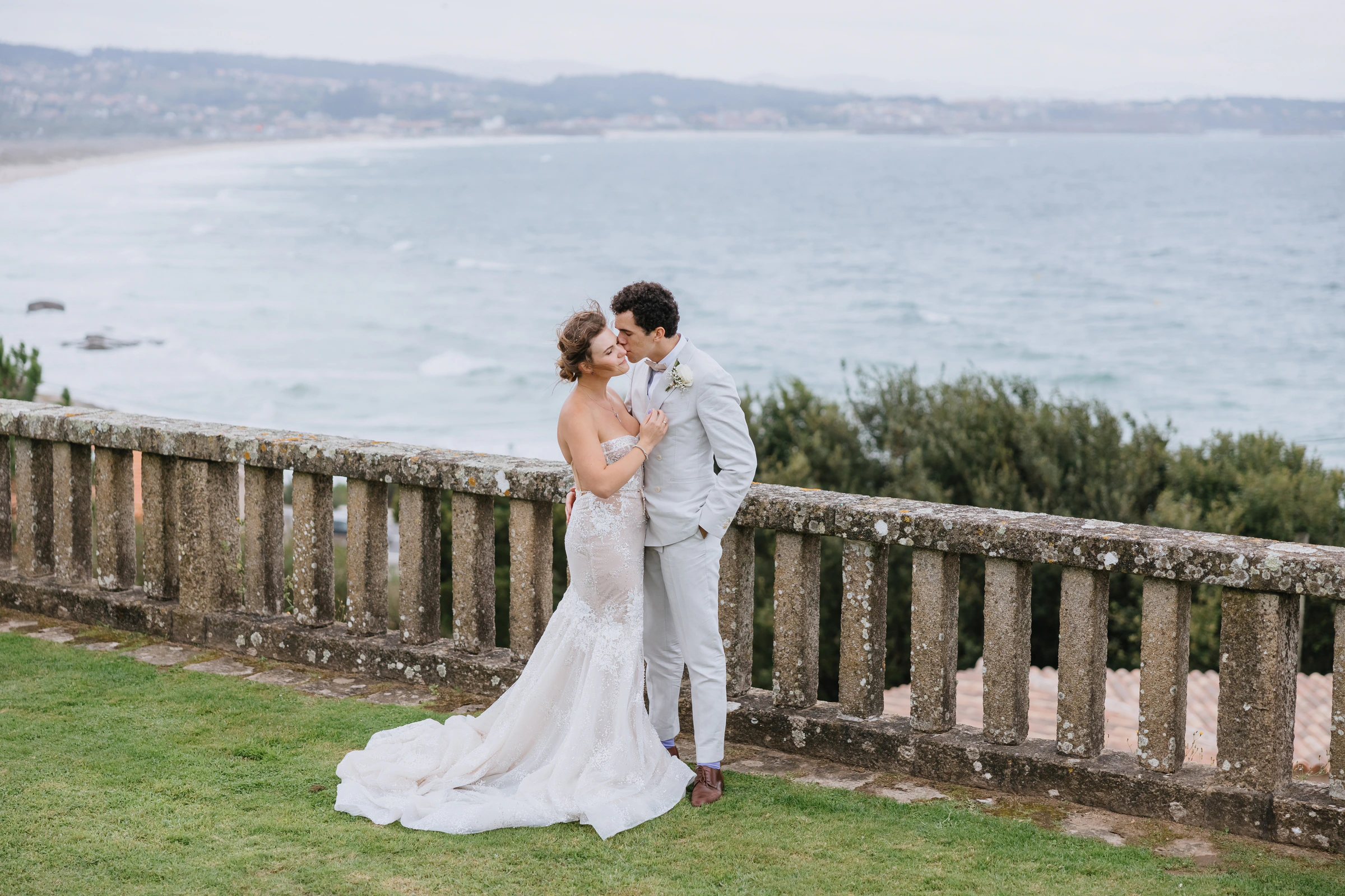Melanie and Elliot overlooking the Atlantic at their wedding in Galicia