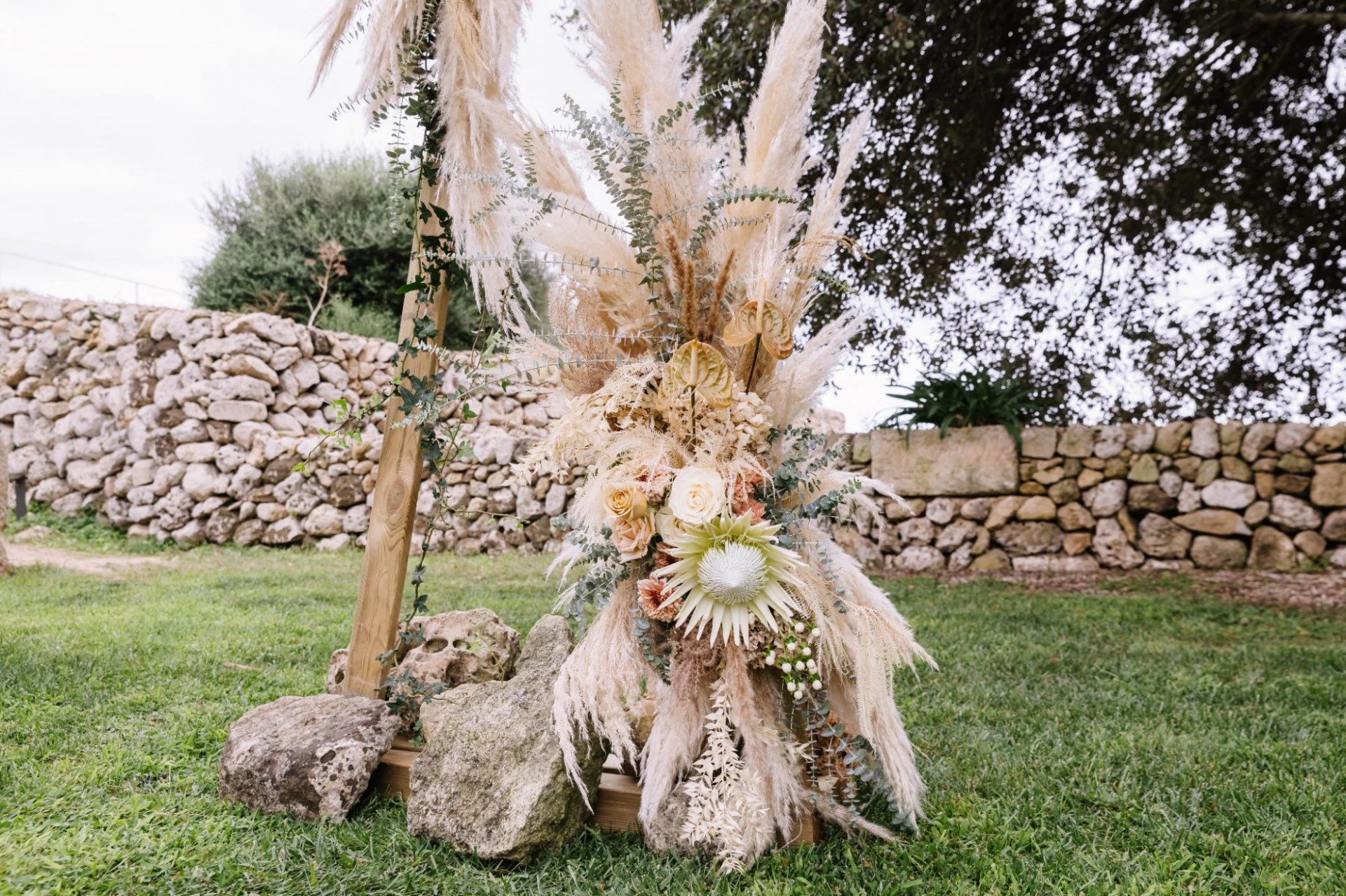 Floral installation prepared for an outdoor destination wedding in Spain