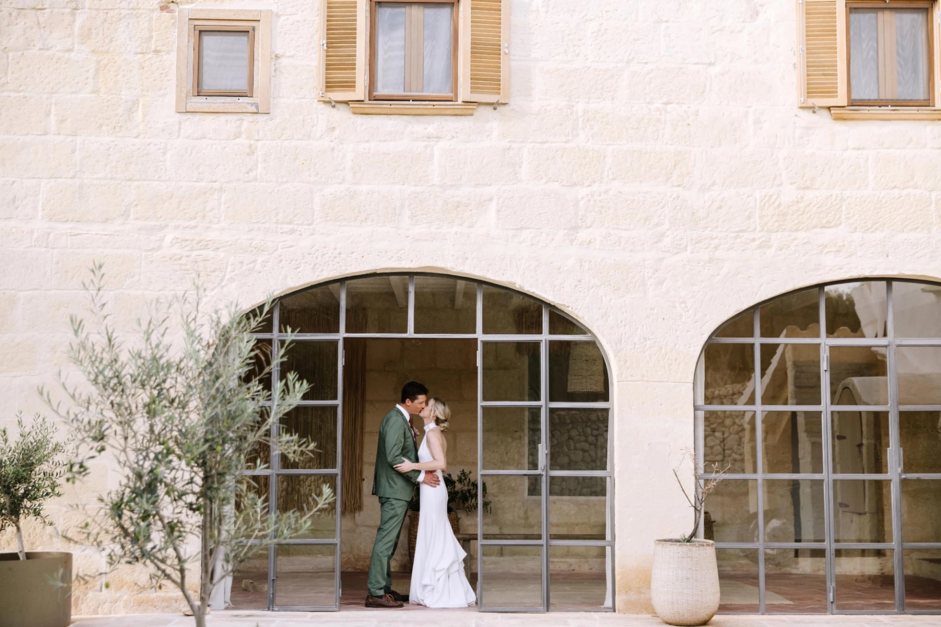 Newlyweds at a pale stone estate in Spain