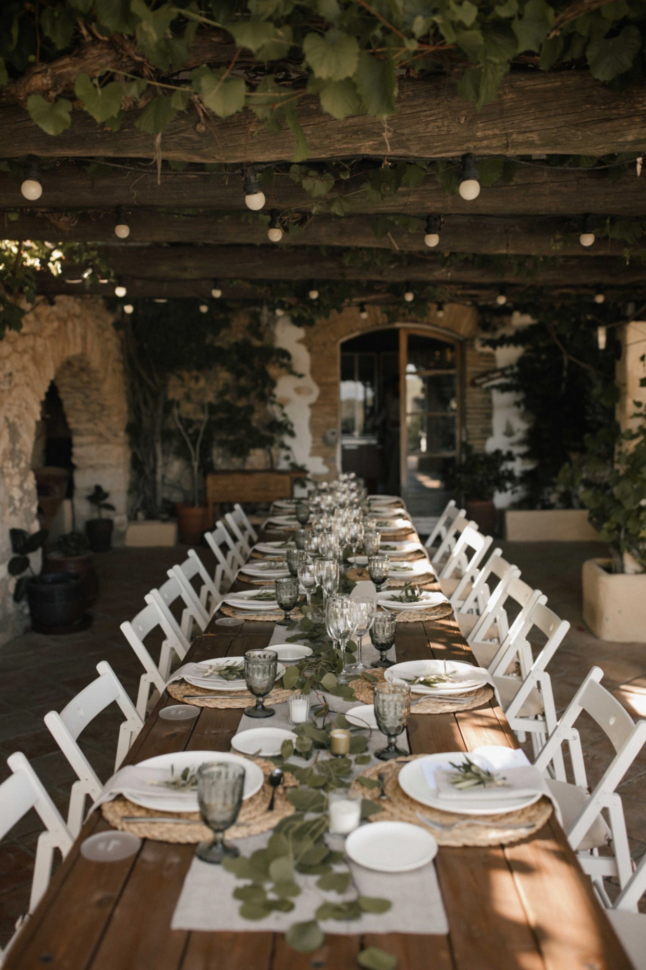 Candlelit outdoor table prepared for Samantha and Barry's wedding in Sitges